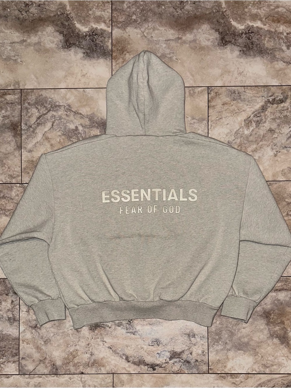 Fear of God Essentials Classic Hoodie
Heather Stone SS25 Size Medium